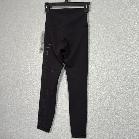 Wunder Train 25” HR tight with lululemon graphic size 4 black - Picture 7 of 8